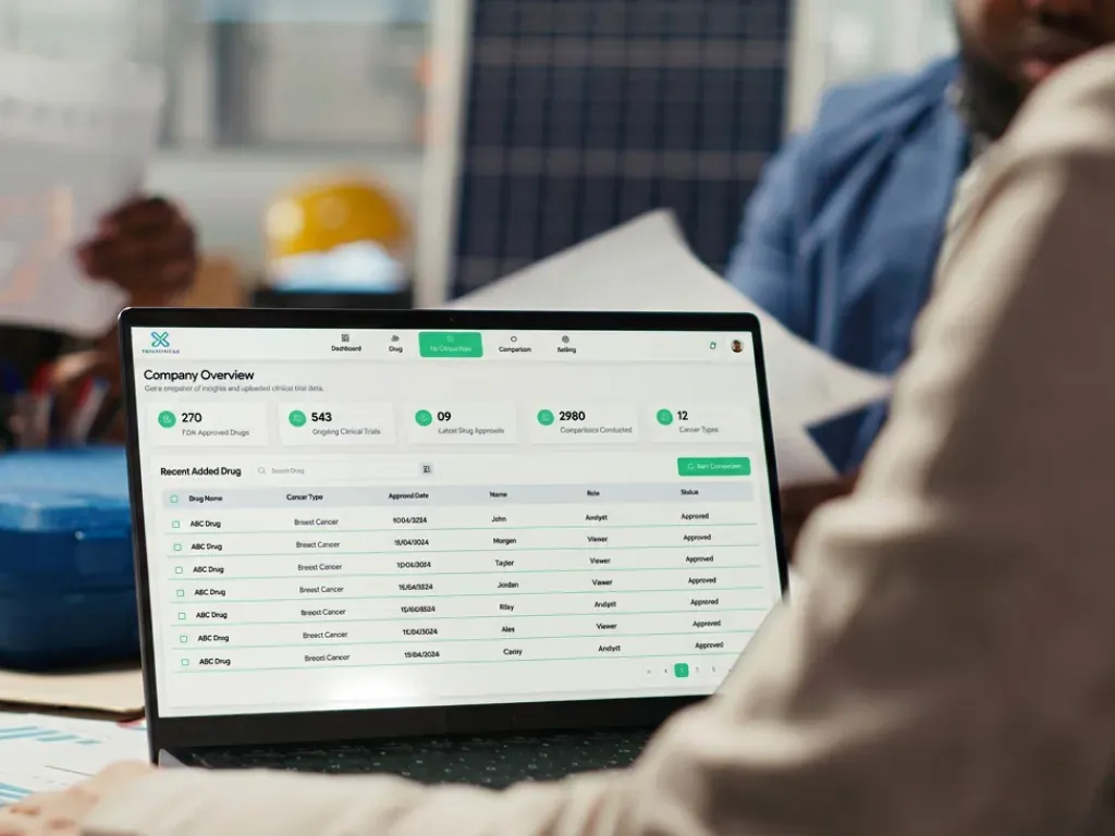 TrialTriage clinical data dashboard on a laptop